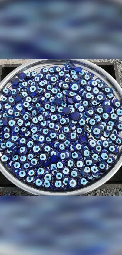 Decorative blue evil eye charms arranged in a circular pattern.