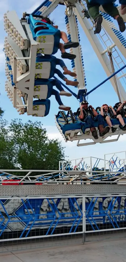 A thrilling amusement park ride in motion, capturing moments of excitement.