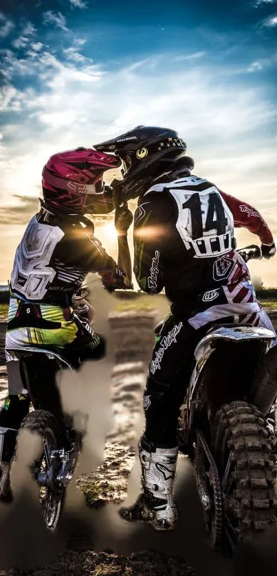 Two dirt bikers enjoy a sunset ride.