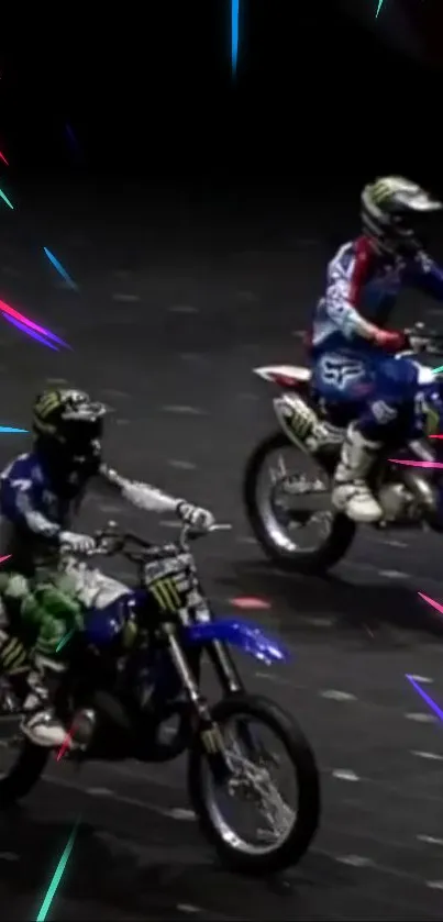 High-speed motocross stunt riders with colorful light trails on dark background.