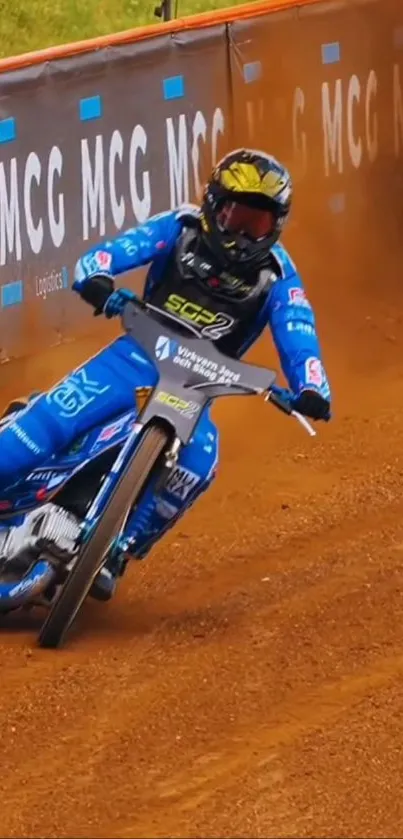 Motorcycle rider racing on a dirt track.