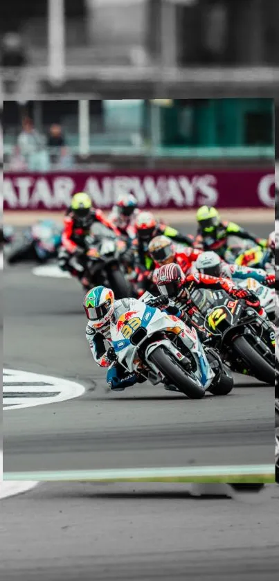 Motorcycle racers competing on a track, captured in dynamic action.