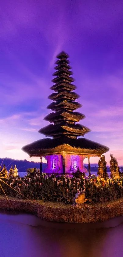 Asian pagoda at sunset with a vibrant purple sky, reflecting on the water.