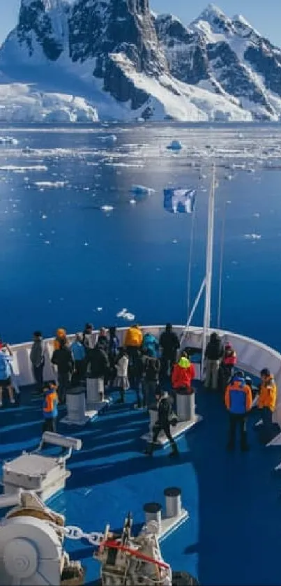 Adventure travelers exploring icy Antarctic waters with mountainous backdrop.