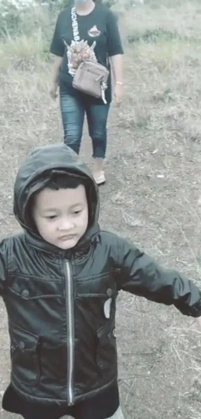 Child in nature exploring with family outdoors