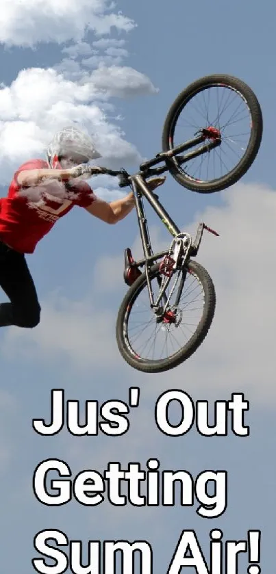 Cyclist performing an aerial stunt against a blue sky.