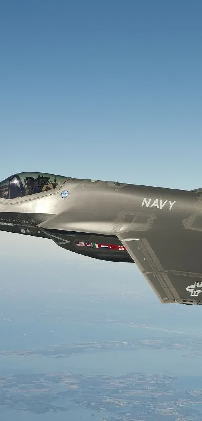 F-35 fighter jet soaring above the ocean.