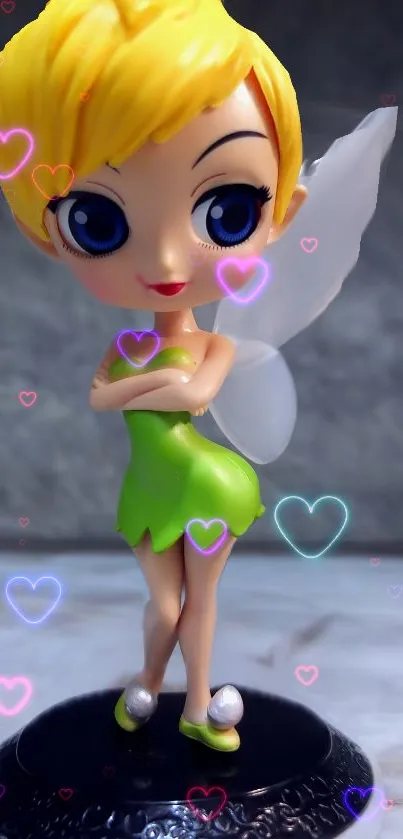 Cute fairy figurine with colorful hearts and a whimsical fantasy design.