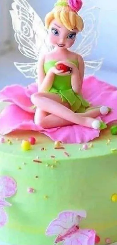 Enchanting fairy sits on colorful cake with pink flower details.