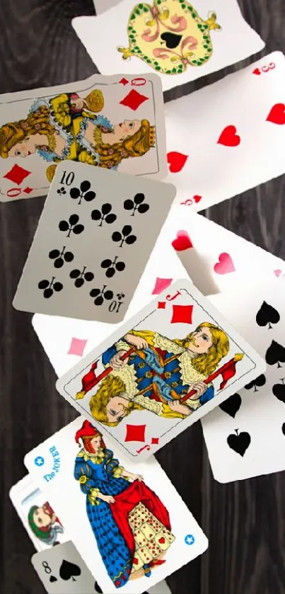 Falling playing cards wallpaper with wooden backdrop.