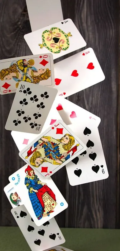 Falling playing cards on a wooden textured background.