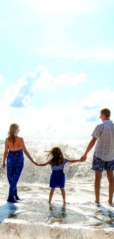 Family enjoying a sunny beach day with waves crashing around them.