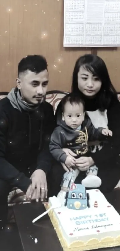 Family celebrating first birthday with cake.