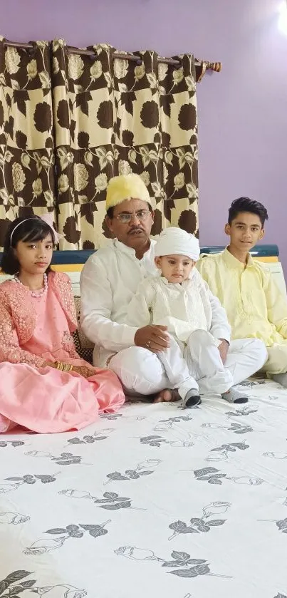 A family celebrating in traditional clothing at home.