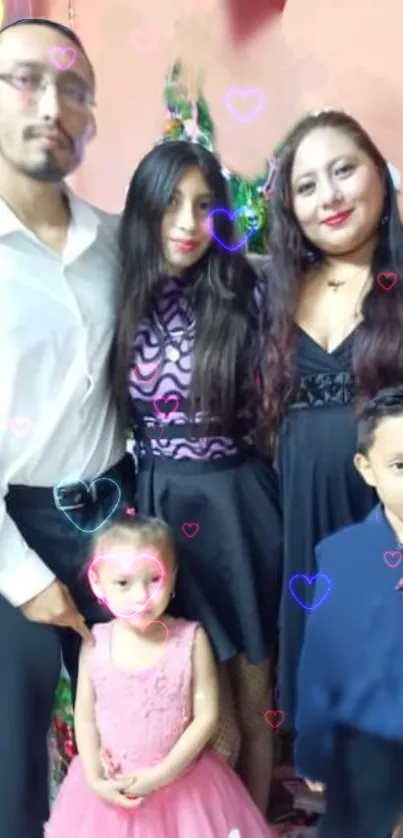 Family gathered with heart decorations and festive attire.