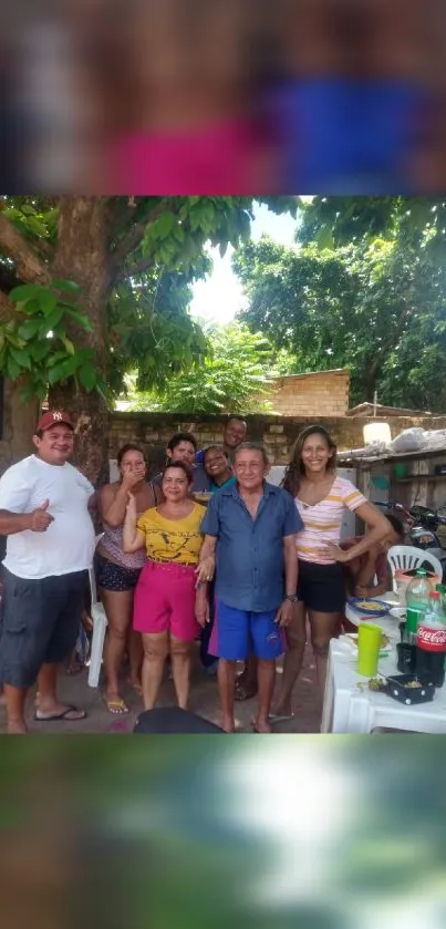 Family gathered in a backyard with lush green surroundings.