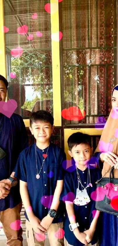 Family together in traditional cultural attire, smiling.