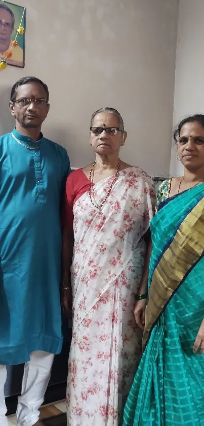 Family photo with traditional attire and vibrant colors.