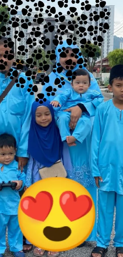 Family in traditional blue attire standing outdoors on a city street.