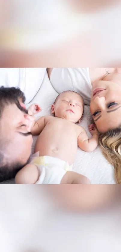 Heartwarming family wallpaper with parents and newborn on bed.