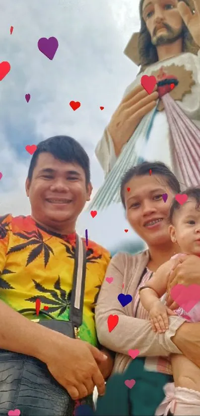 Family with hearts next to a statue on a vibrant mobile wallpaper.