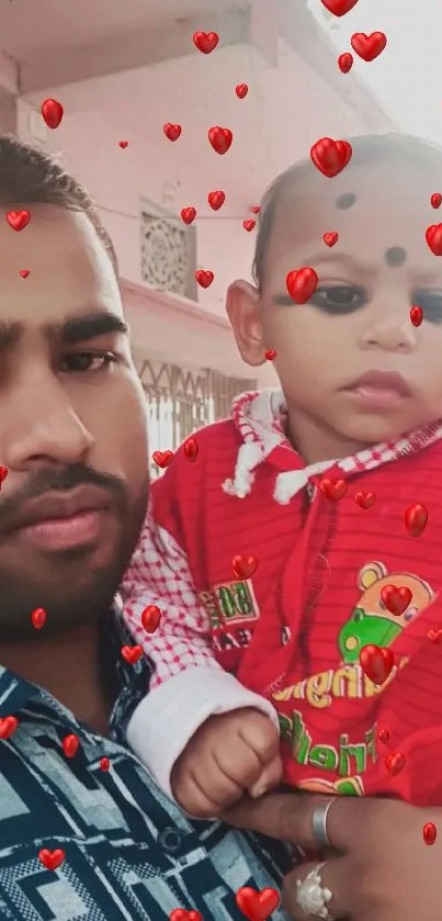 A heartwarming family moment with a baby in red attire.