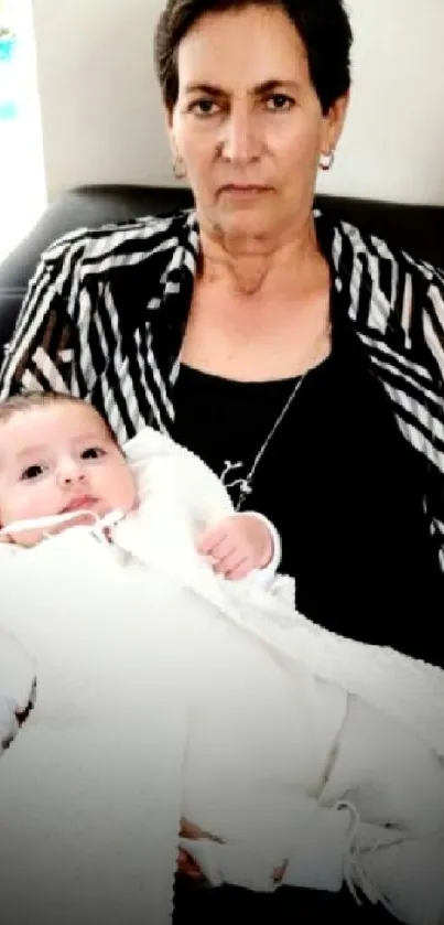 Grandmother holding infant in peaceful embrace, creating a warm family moment.