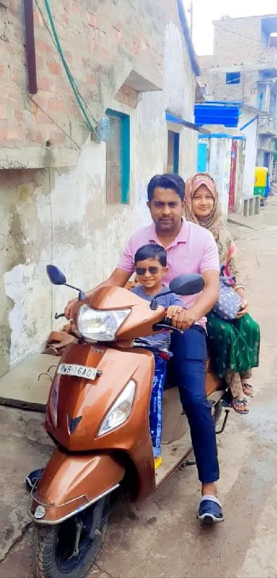 Family on scooter enjoying a ride down a street.