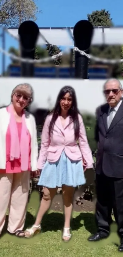 Family posing outdoors in sunny garden.