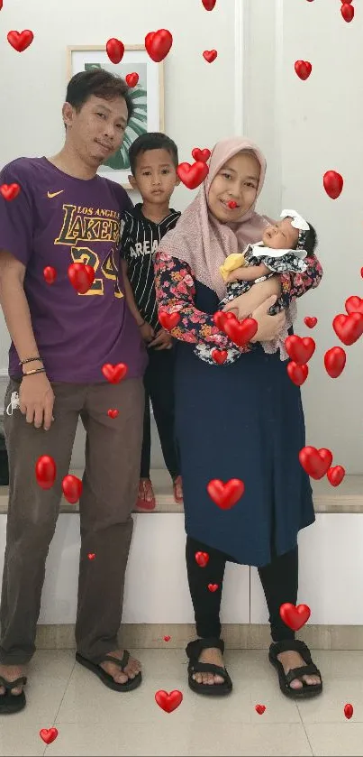 A family standing in a bright room with light walls and floor.