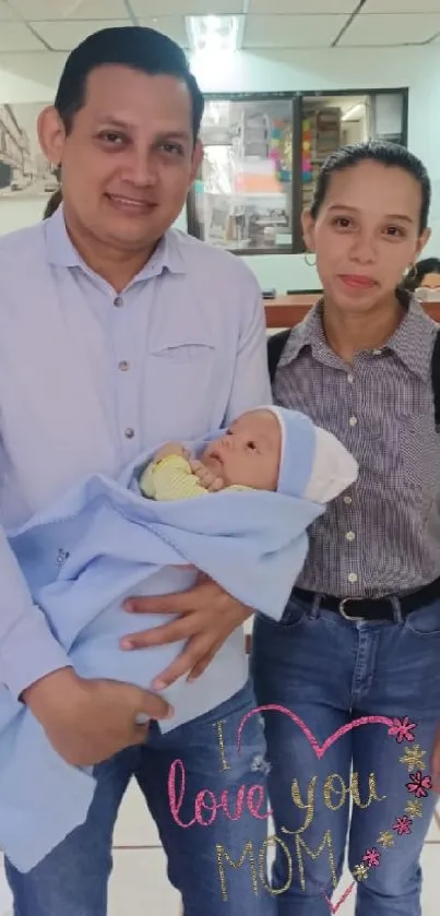 Family with newborn baby wrapped in blue blanket, emotive moment.