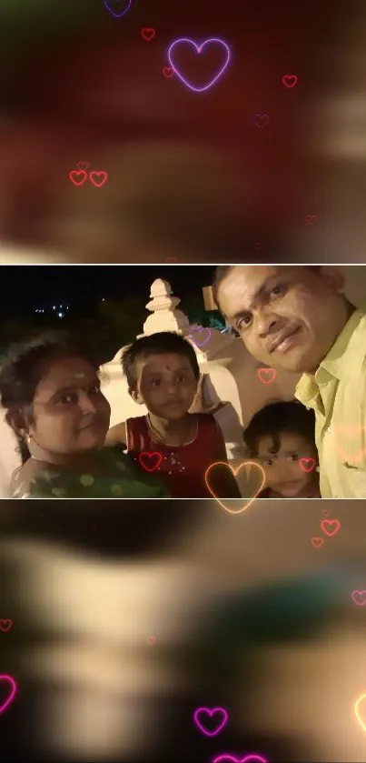 Family selfie with colorful heart overlays creating a warm atmosphere.