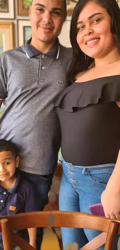 Family smiling together in casual home setting.