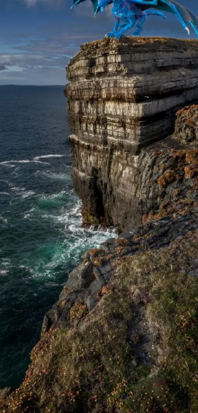 Majestic dragon on a cliff by the ocean under a vast sky.