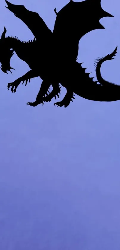 Silhouette of a dragon on a periwinkle background wallpaper.