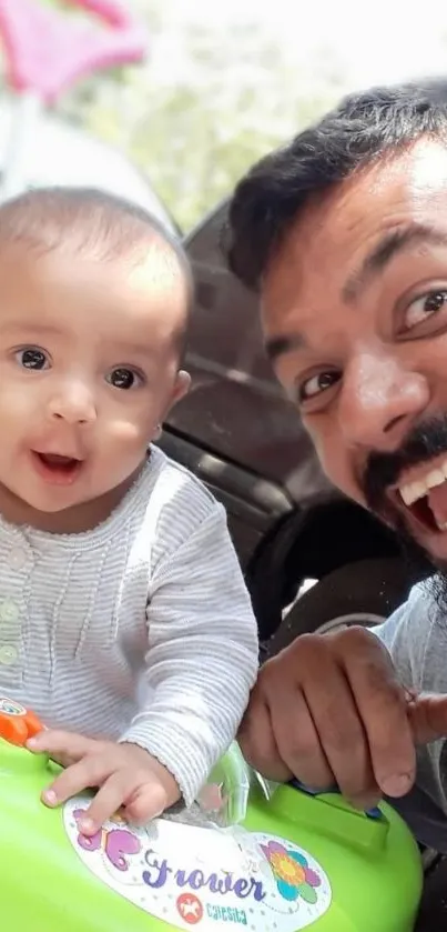 Father and baby smiling together in a bright, cheerful moment.