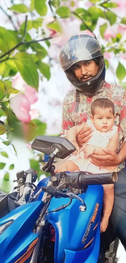 Father and child on a motorcycle with flowers and leaves in the background.