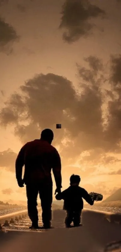 Silhouette of father and child walking at sunset.