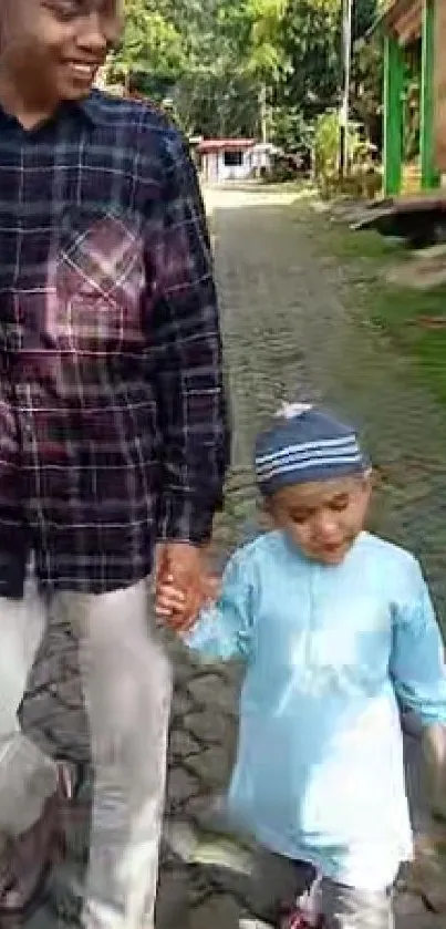 Father and child walking on a sunny street.