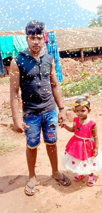 Father and daughter holding hands in a rustic outdoor setting.