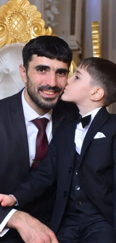 Father and son in suits sharing a special moment.