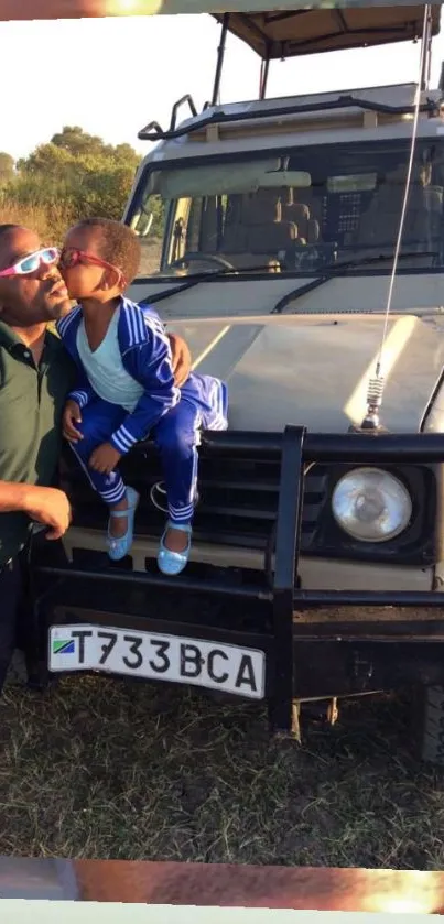 Father and son share a safari moment against a scenic wildlife backdrop.