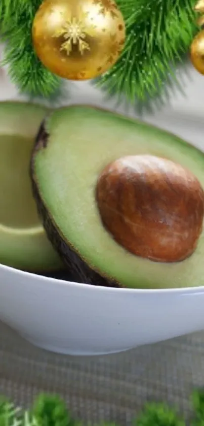 Festive avocado and golden decorations in white bowl.