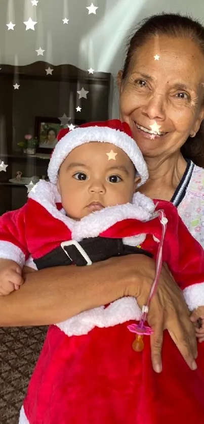 Grandparent holding baby in Santa outfit with a joyful smile.