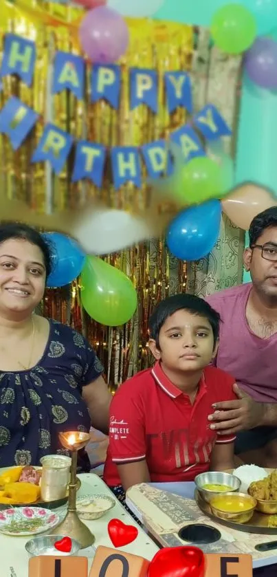 A family celebrating a birthday with festive decor and balloons.