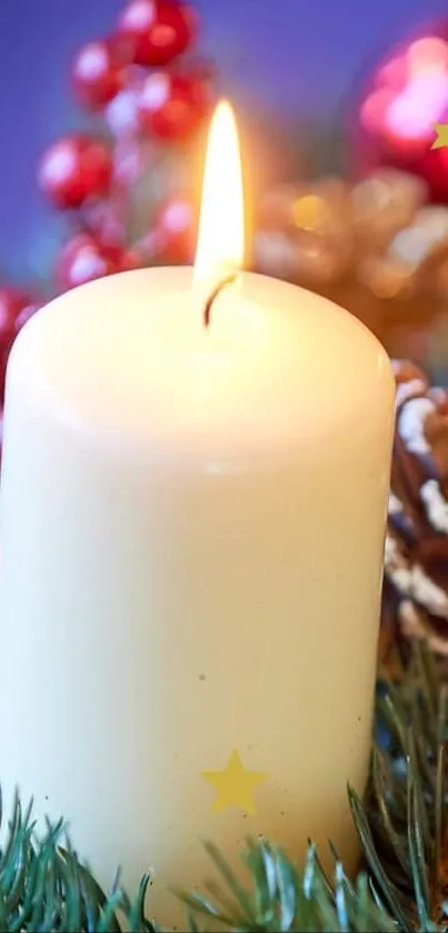 Glowing candle with Christmas decorations and greenery.