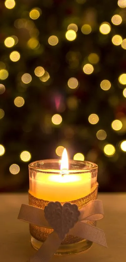 Candle with Christmas tree bokeh lights in the background.