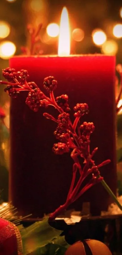 Red candle glowing among festive lights.