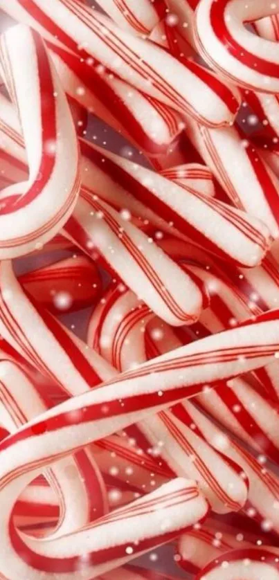 Red and white candy cane wallpaper with festive snow.