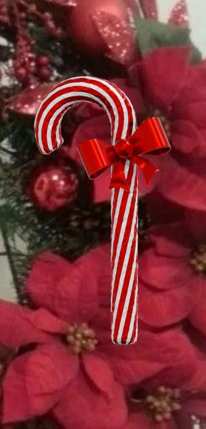 Festive candy cane with poinsettias on holiday wreath.